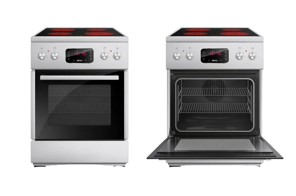 Técnico de mantenimiento reparando un horno en una cocina de Salou, utilizando herramientas profesionales para garantizar la seguridad y eficiencia del electrodoméstico.